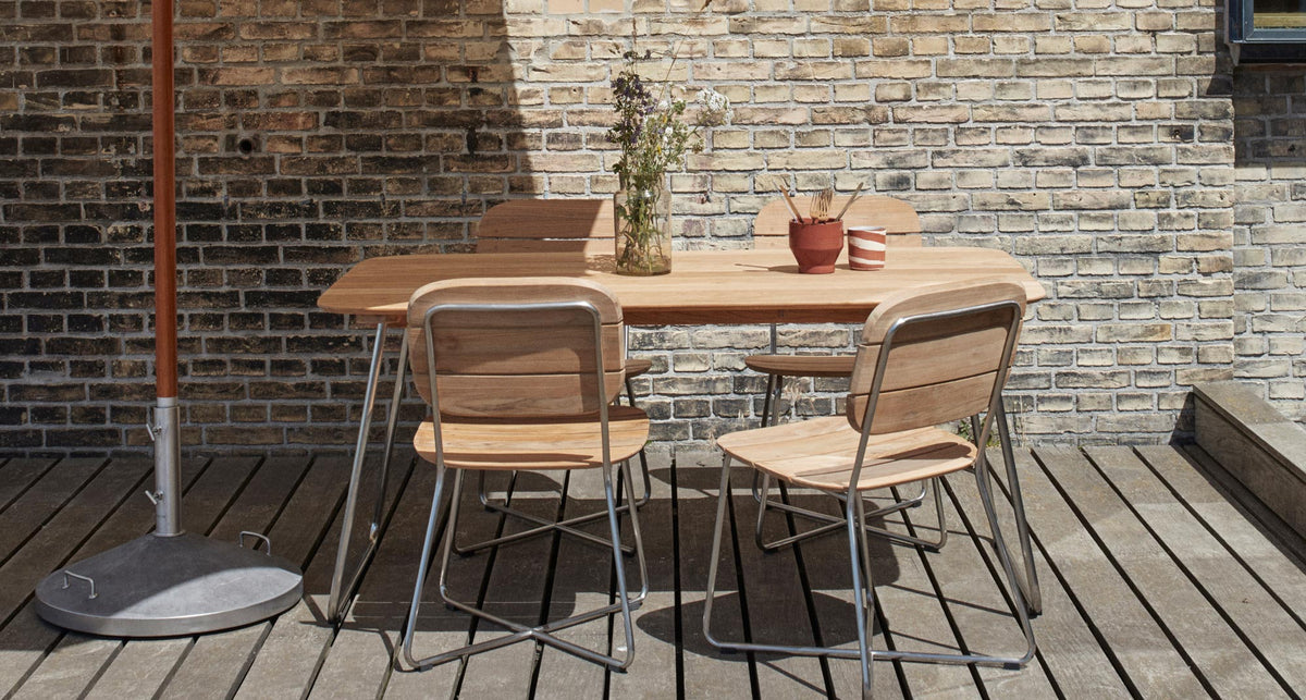 Lilium Teak Chair by Skagerak, showing lilium teak chair in live shot.