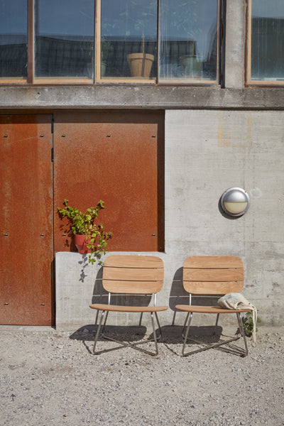 Lilium Teak Lounge Chair by Skagerak, showing Lilium teak lounge chair in live shot.