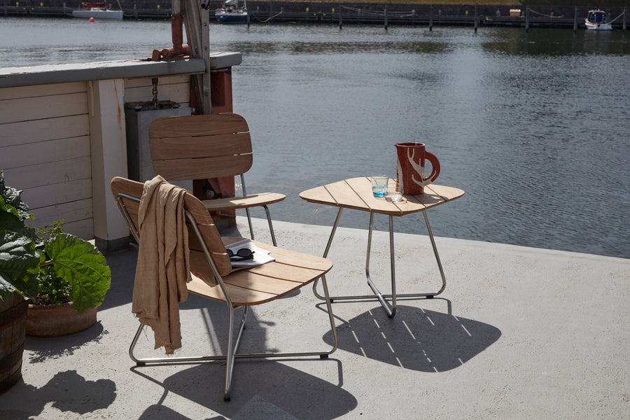 Lilium Teak Lounge Chair by Skagerak, showing Lilium teak lounge chair in live shot.