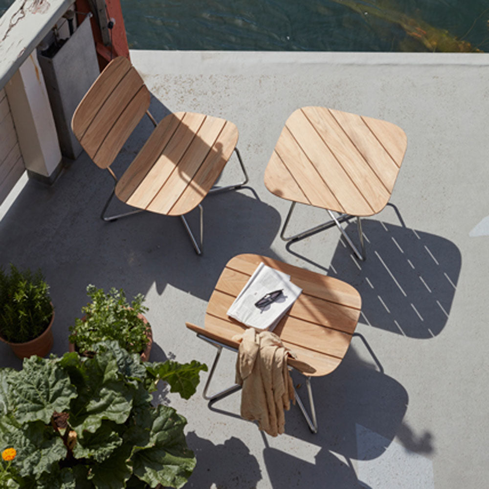Lilium Teak Lounge Chair by Skagerak, showing Lilium teak lounge chair in live shot.