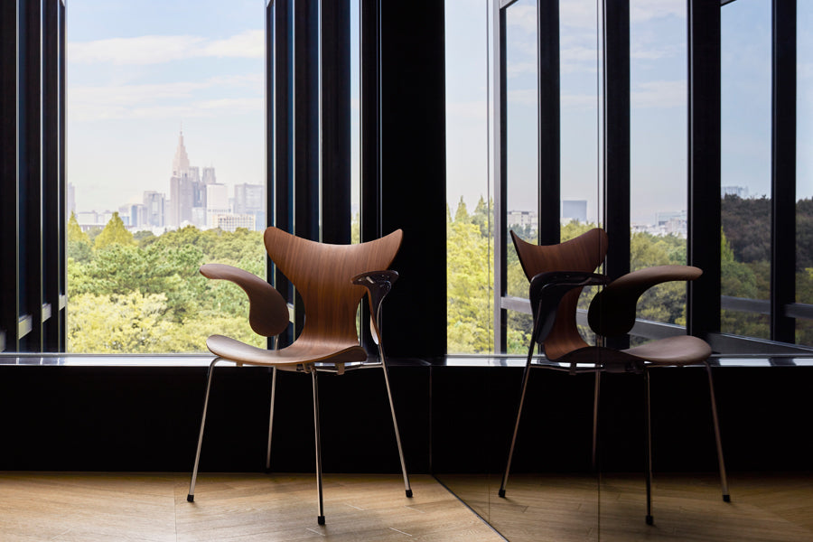 Lily Armchair by Fritz Hansen, showing lily armchairs in live shot.