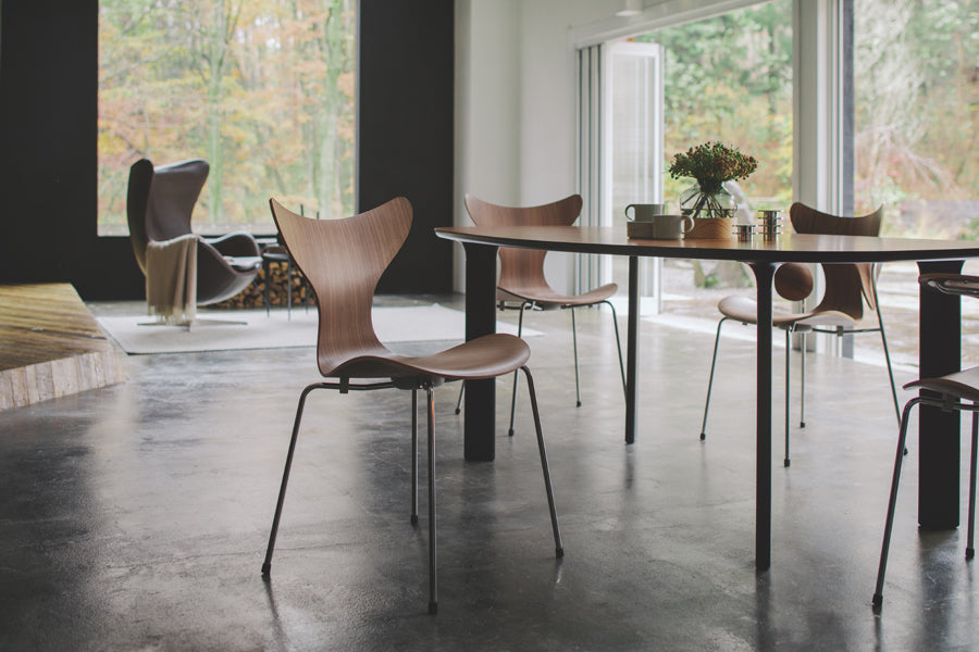 Lily Chair by Fritz Hansen, showing lily chairs in live shot.