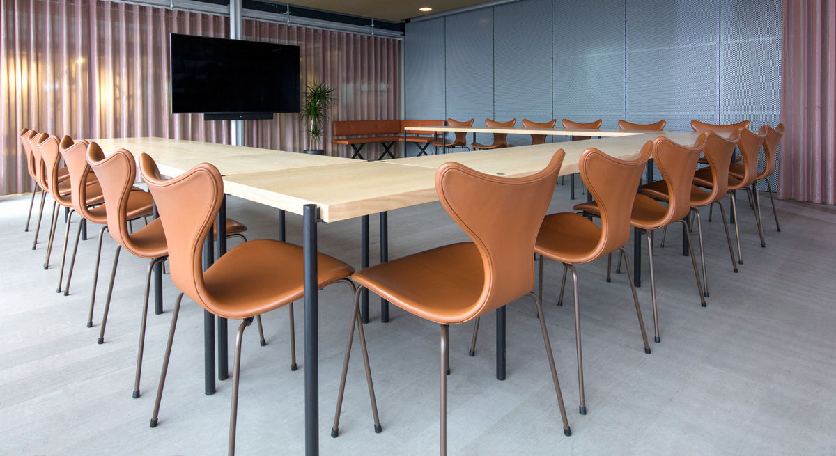 Lily Chair by Fritz Hansen, showing lily chairs in live shot.