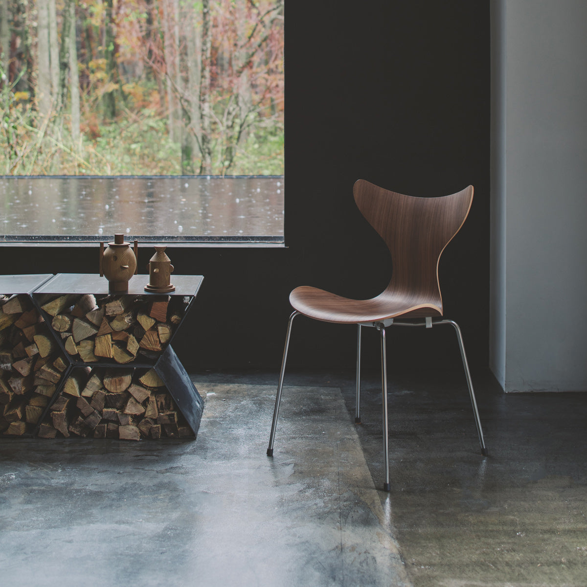 Lily Chair by Fritz Hansen, showing lily chair in live shot.
