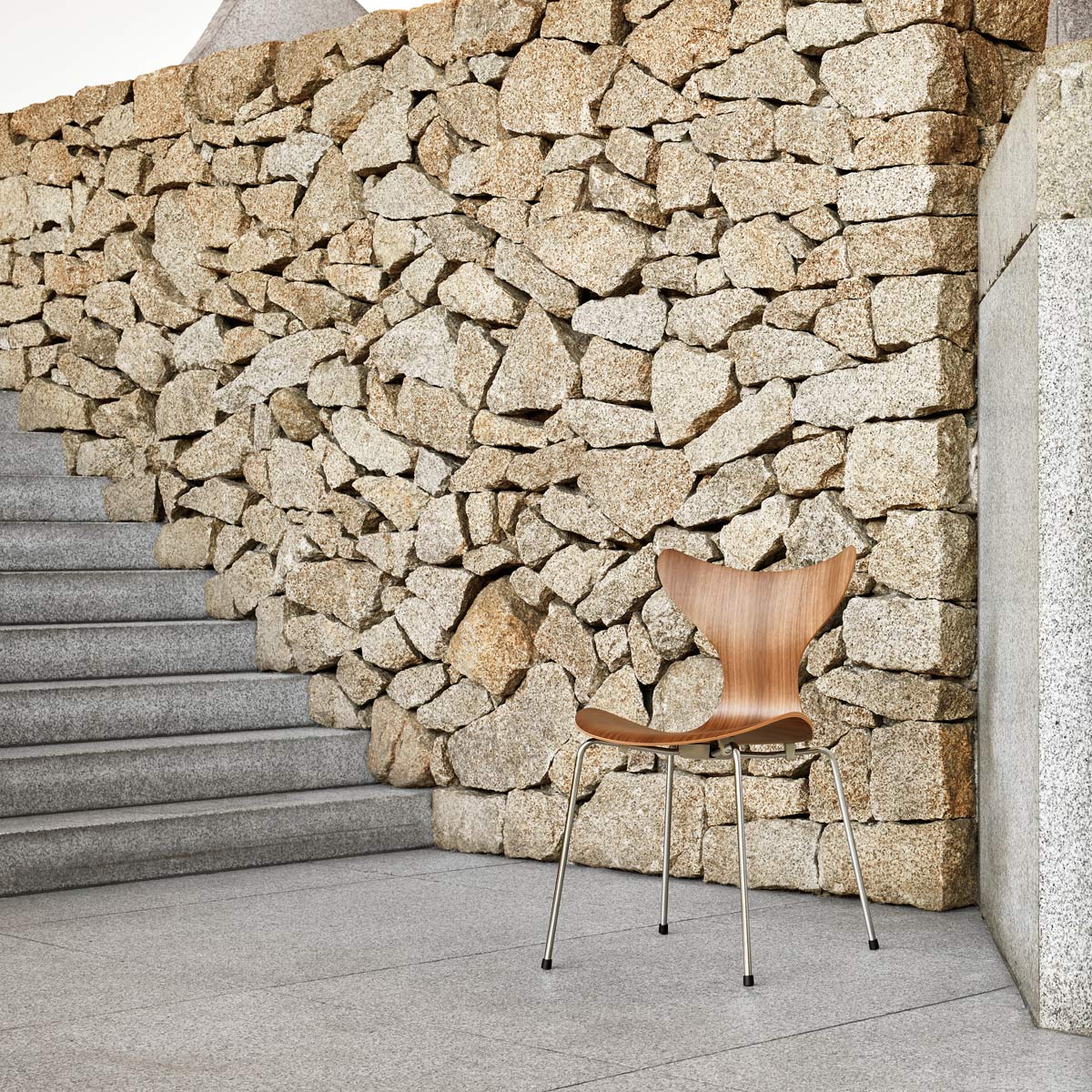 Lily Chair by Fritz Hansen, showing lily chair in live shot.