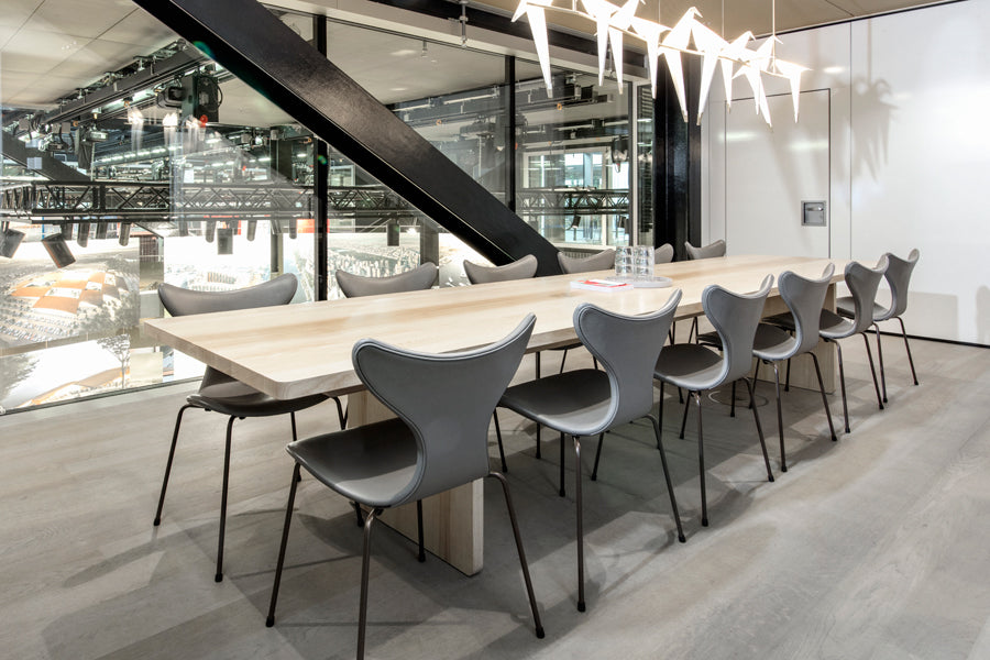 Lily Chair by Fritz Hansen, showing lily chairs in live shot.