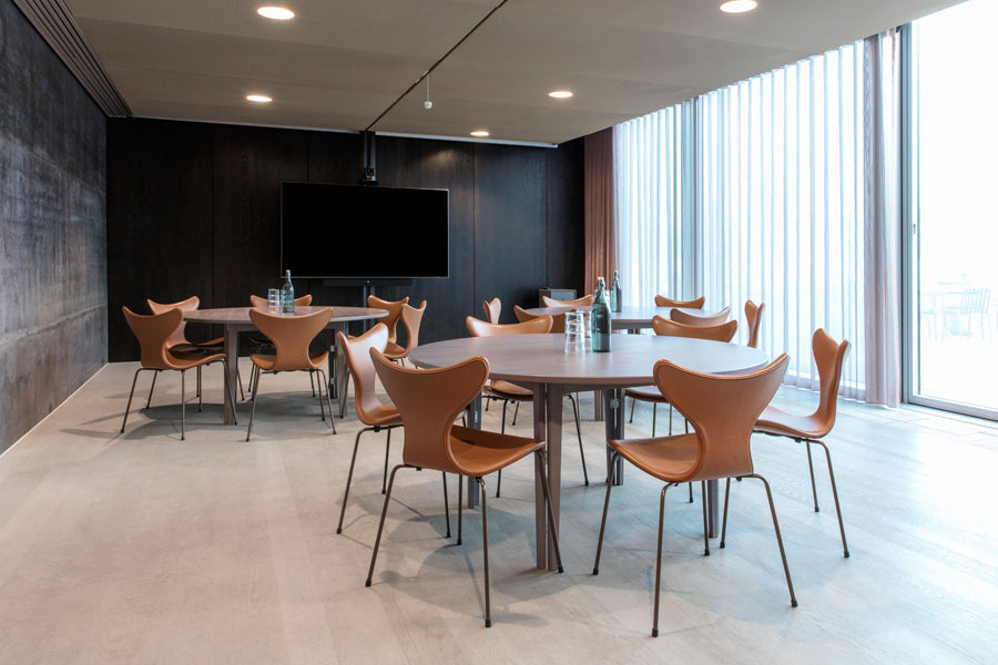 Lily Chair by Fritz Hansen, showing lily chairs in live shot.
