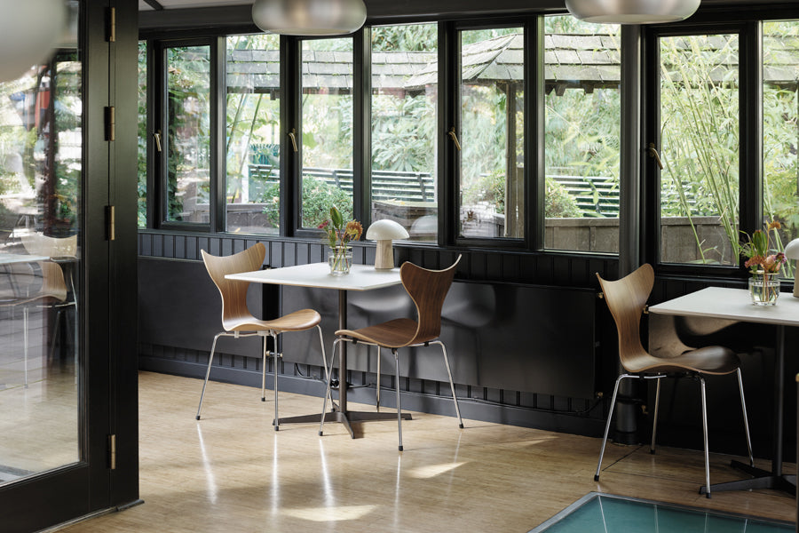 Lily Chair by Fritz Hansen, showing lily chairs in live shot.