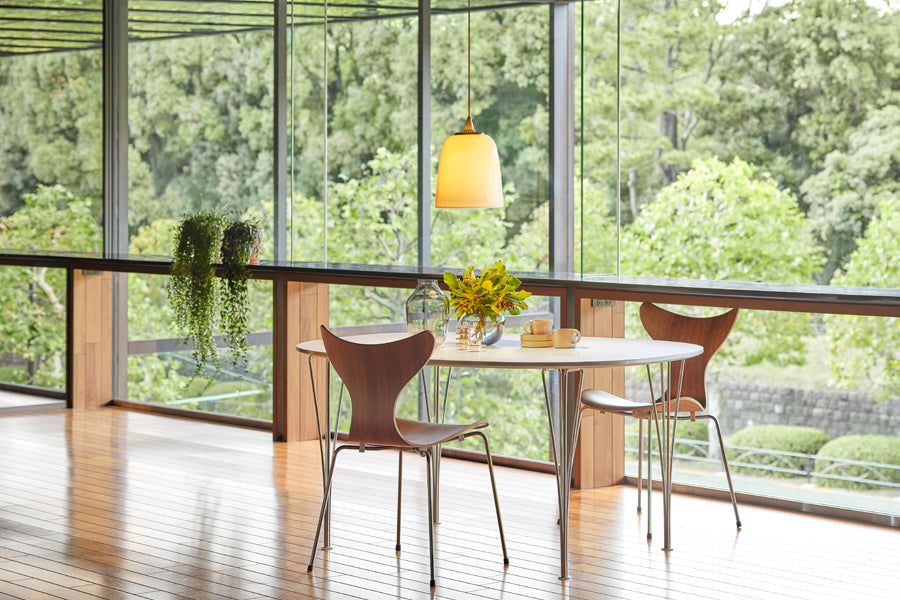 Lily Chair by Fritz Hansen, showing lily chairs in live shot.