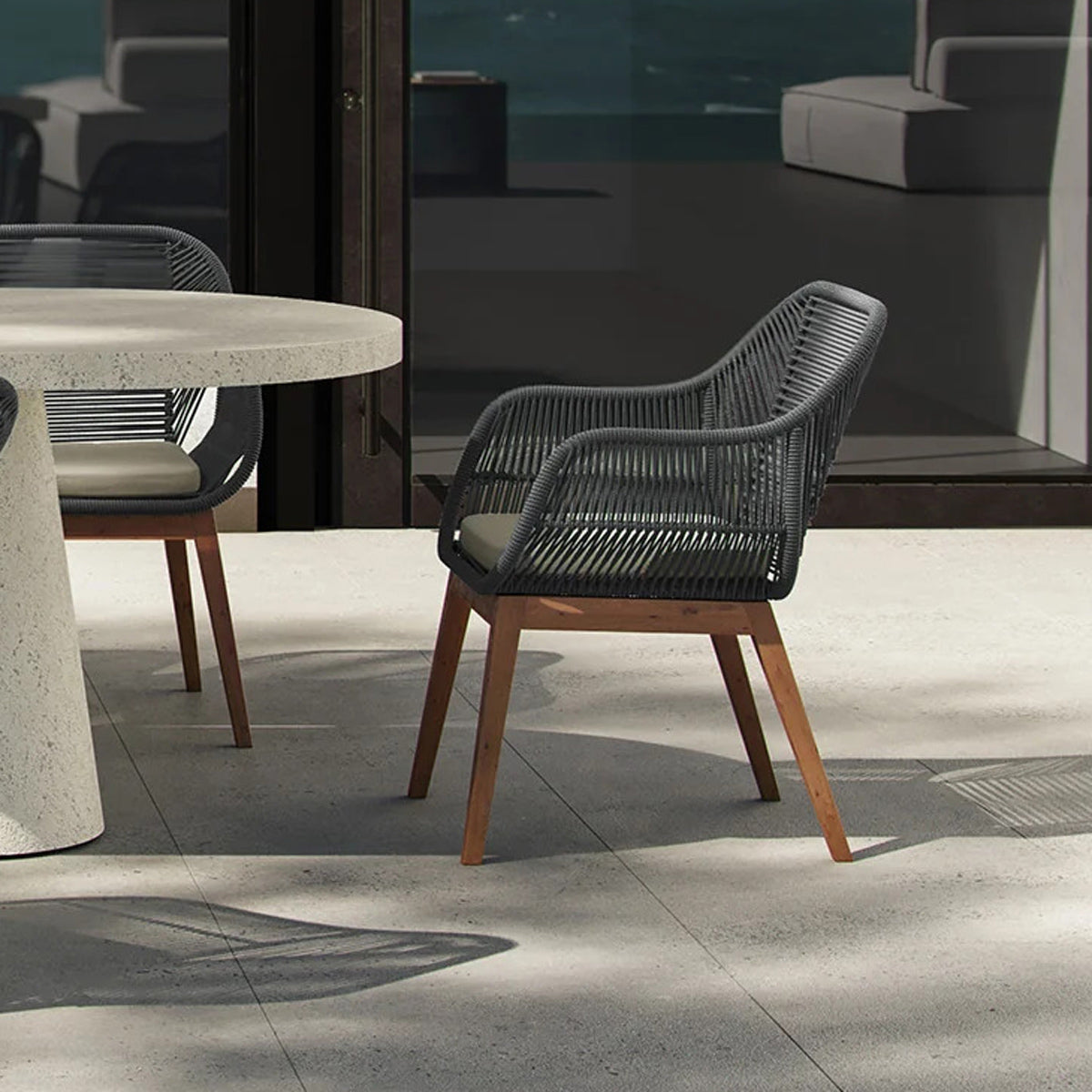 Liora Outdoor Dining Chair by Viesso, showing liora outdoor dining chairs in live shot.