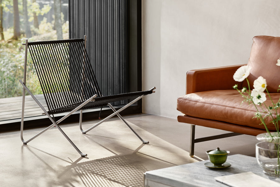 Lissoni Lounge Chair by Fritz Hansen, showing closeup view of lissoni lounge chair in live shot.