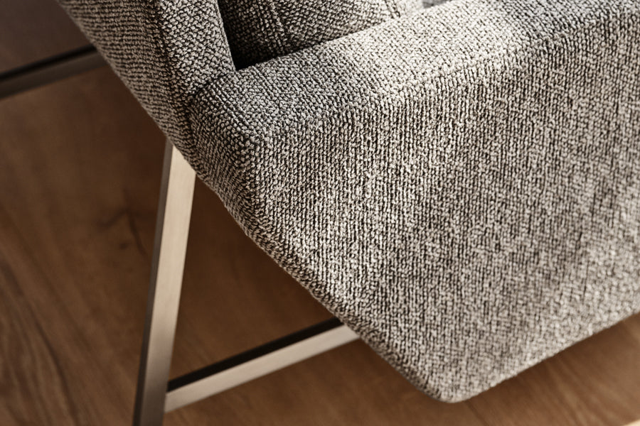 Lissoni Lounge Chair by Fritz Hansen, showing closeup view of lissoni lounge chair in live shot.