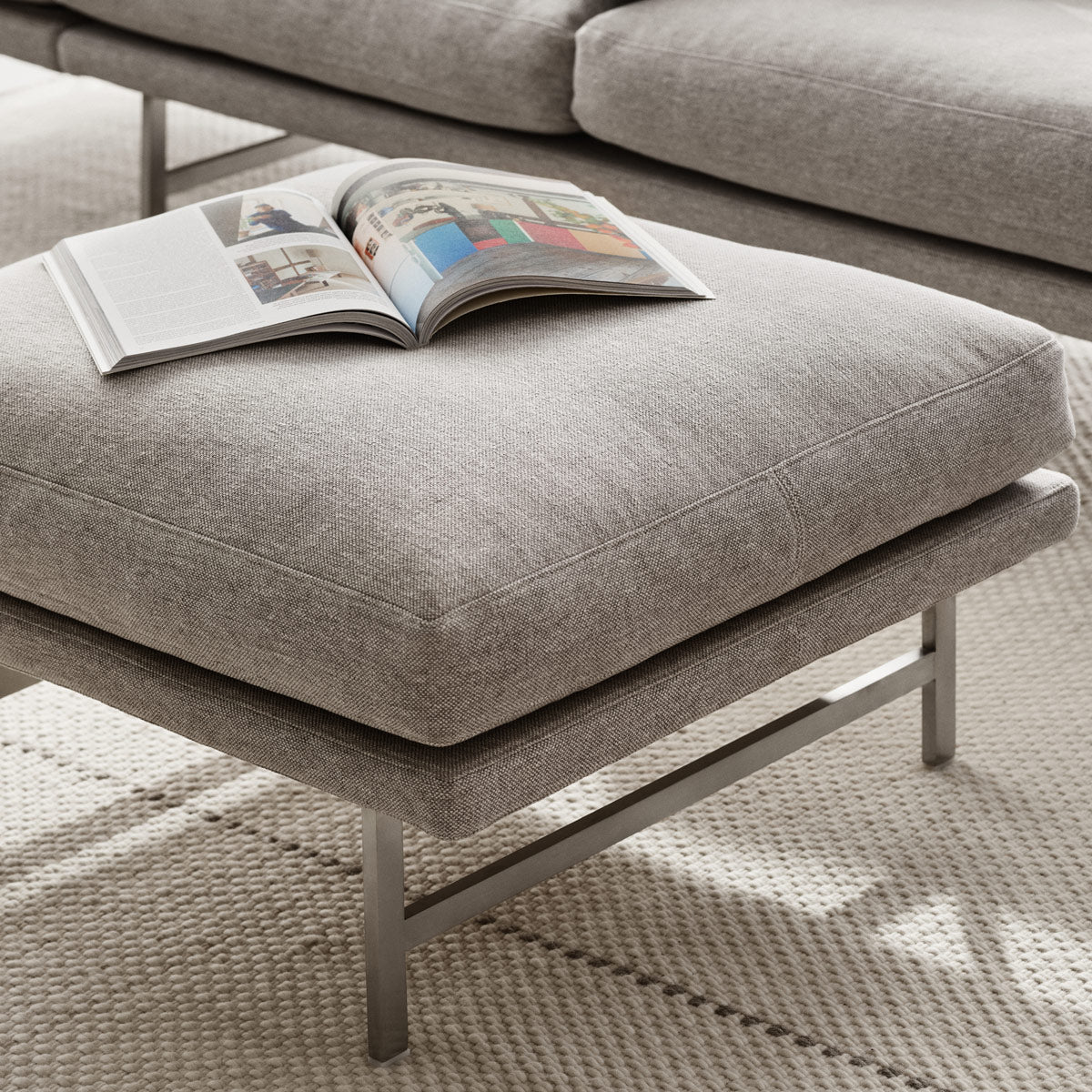 Lissoni Pouf by Fritz Hansen, showing closeup view of lissoni pouf in live shot.