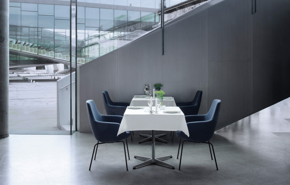 Little Giraffe Chair by Fritz Hansen, showing little giraffe chairs in live shot.