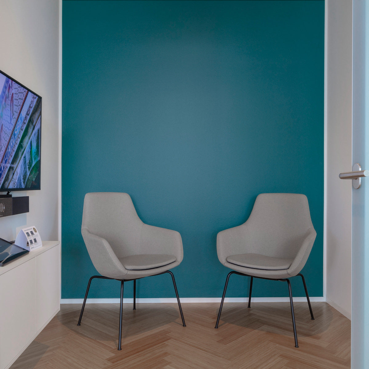 Little Giraffe Chair by Fritz Hansen, showing little giraffe chairs in live shot.
