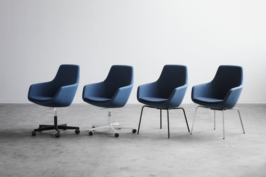 Little Giraffe Chair by Fritz Hansen, showing little giraffe chairs in live shot.