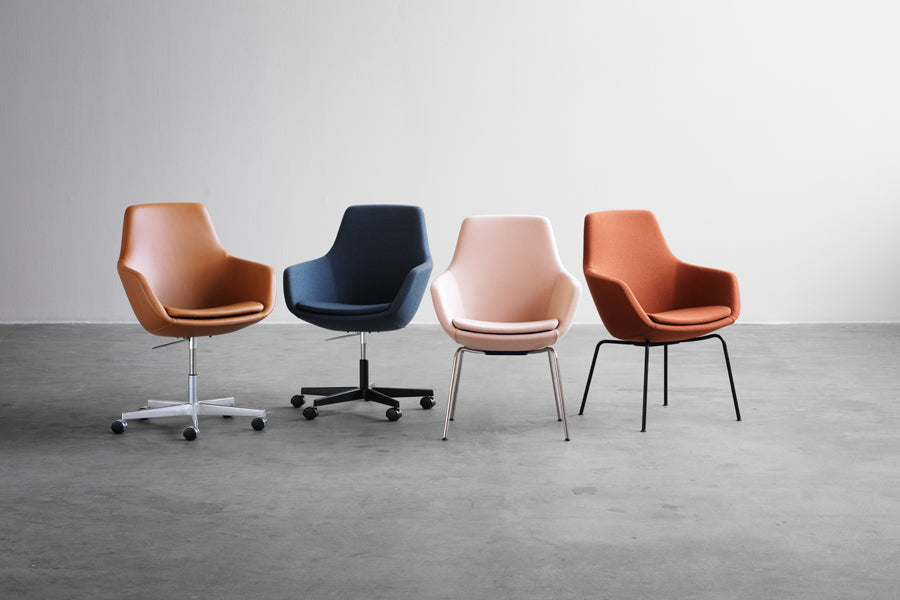 Little Giraffe Chair by Fritz Hansen, showing little giraffe chairs in live shot.