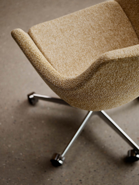 Little Giraffe Removable Cover Swivel Chair by Fritz Hansen, showing closeup view of little giraffe removable cover swivel chair in live shot.