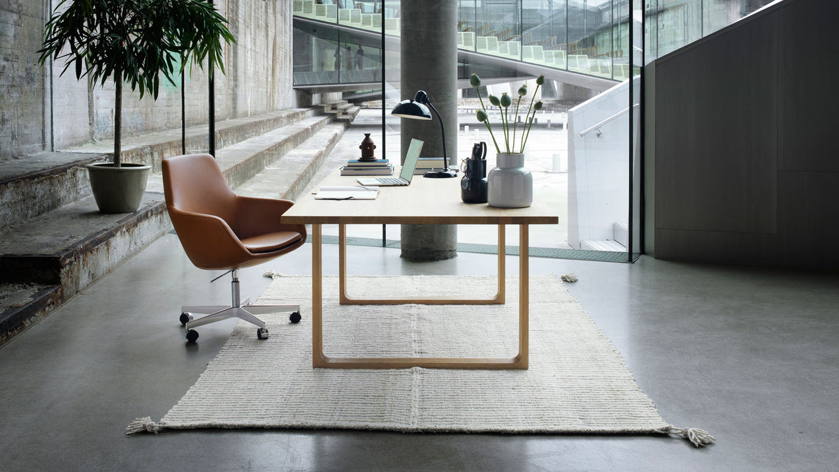 Little Giraffe Removable Cover Swivel Chair by Fritz Hansen, showing little giraffe removable cover swivel chair in live shot.