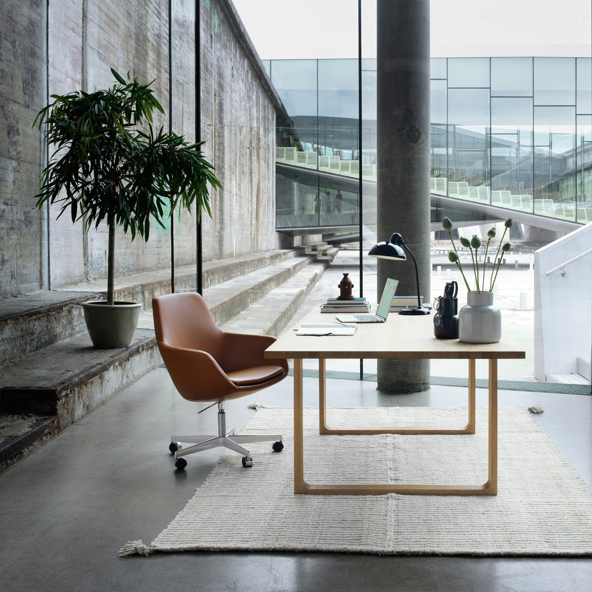 Little Giraffe Swivel Chair by Fritz Hansen, showing little giraffe swivel chair in live shot.
