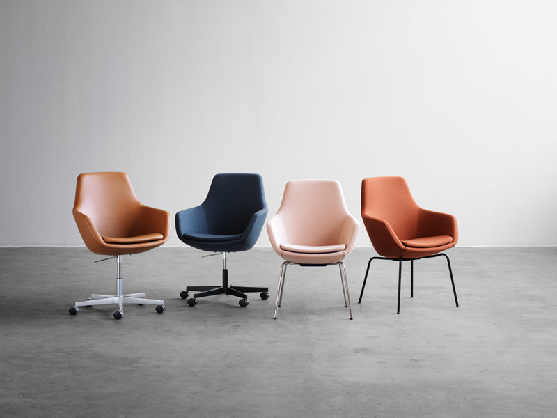 Little Giraffe Swivel Chair by Fritz Hansen, showing little giraffe swivel chairs in live shot.