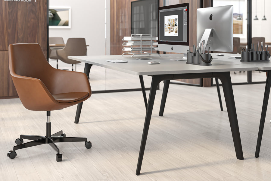 Little Giraffe Swivel Chair by Fritz Hansen, showing little giraffe swivel chair in live shot.