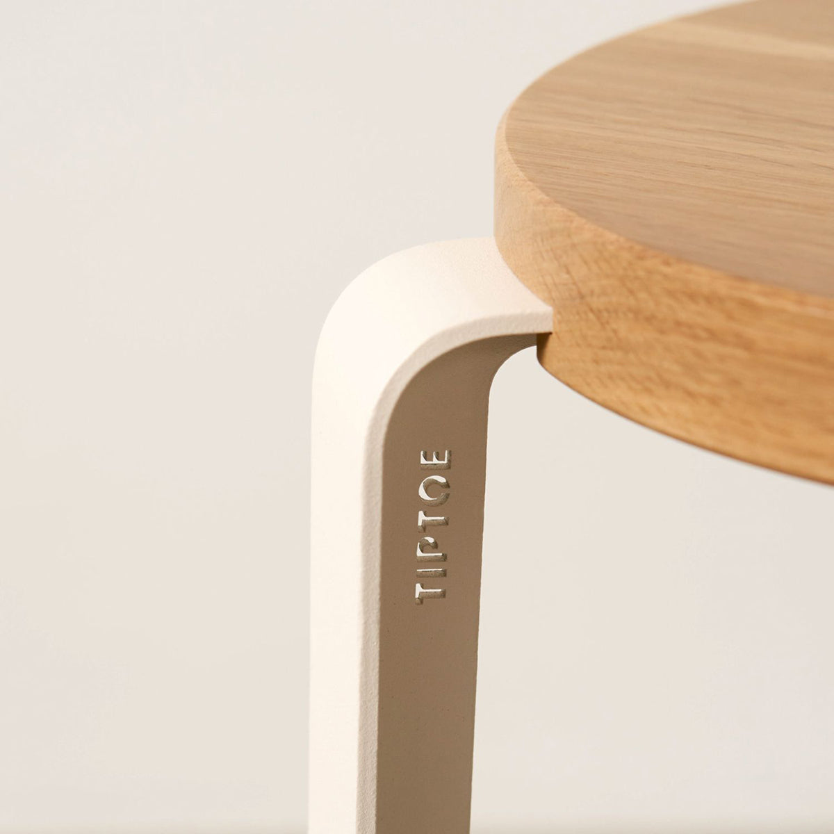 Lou Triangle Bar Stool by TipToe, showing closeup view of lou triangle bar stool in live shot.