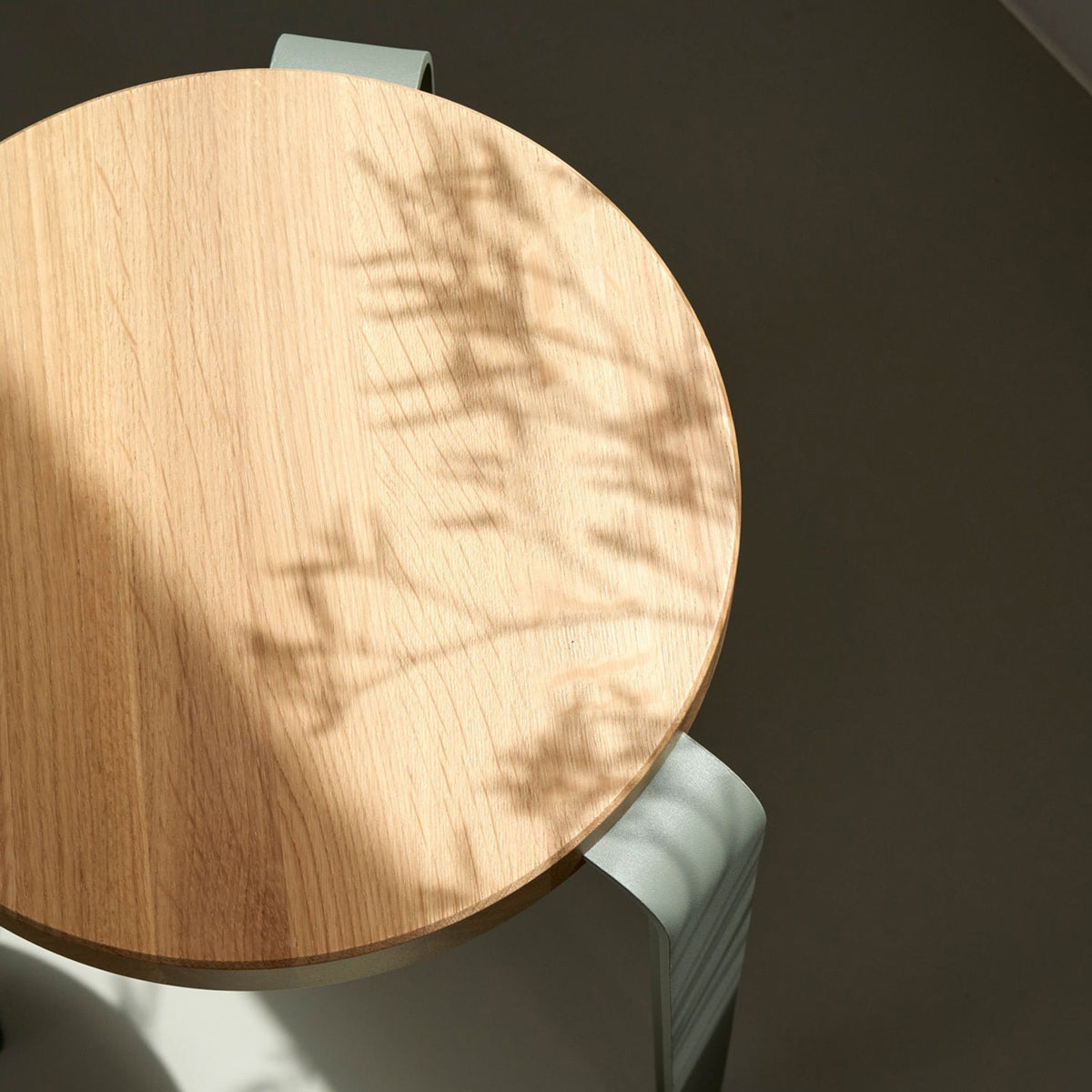 Lou Triangle Bar Stool by TipToe, showing closeup view of lou triangle bar stool in live shot.