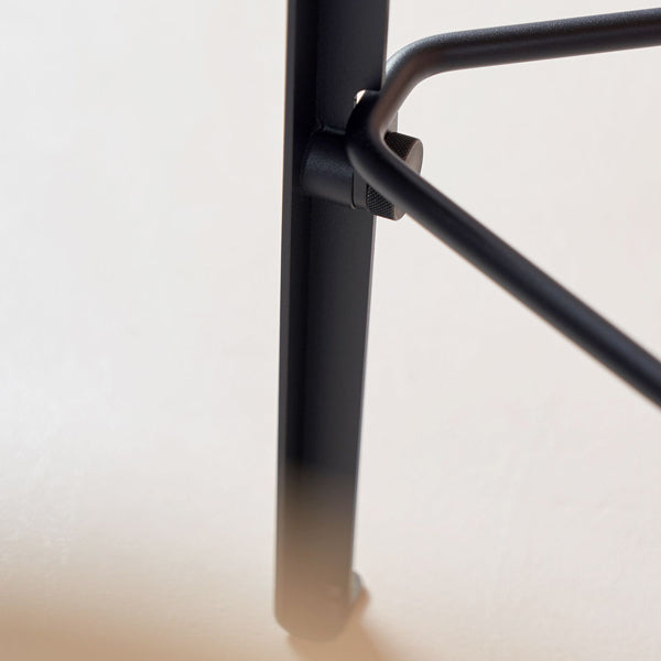 Lou Triangle Bar Stool by TipToe, showing closeup view of lou triangle bar stool in live shot.