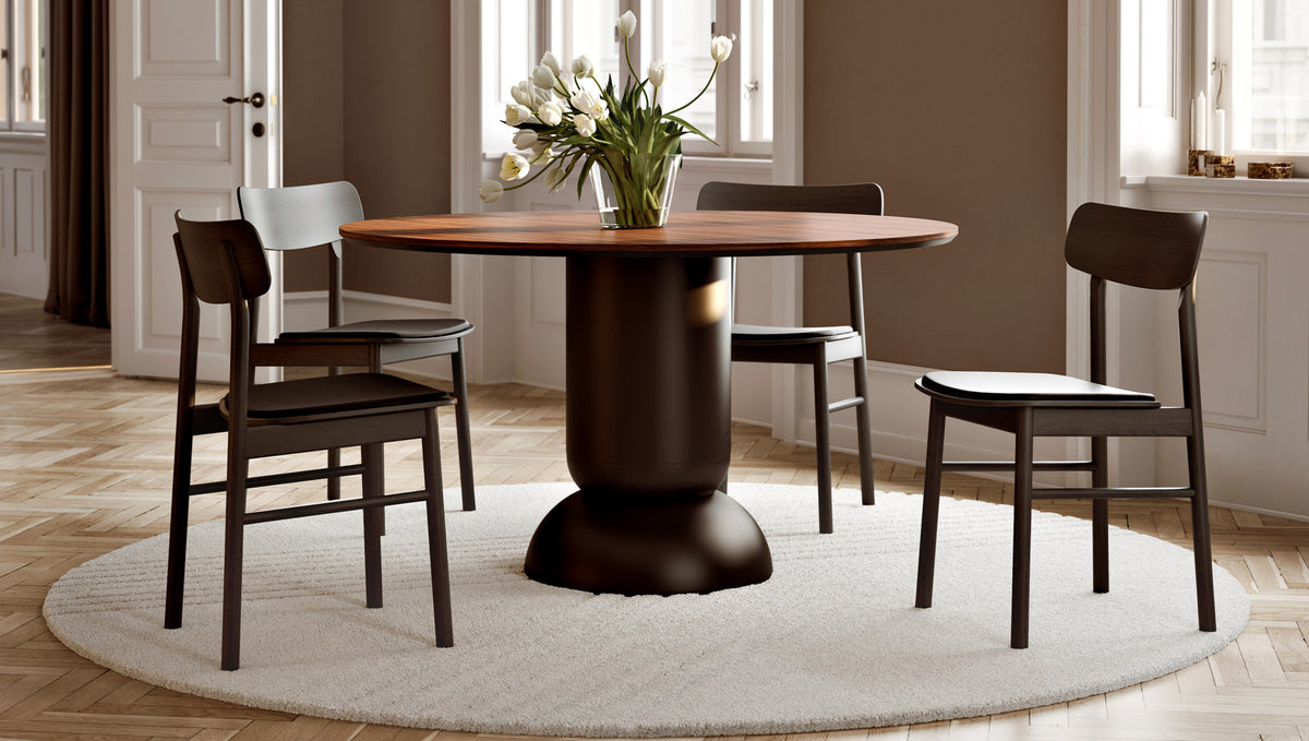 Ludo Dining Table by Woud, showing ludo dining table with chairs in live shot.