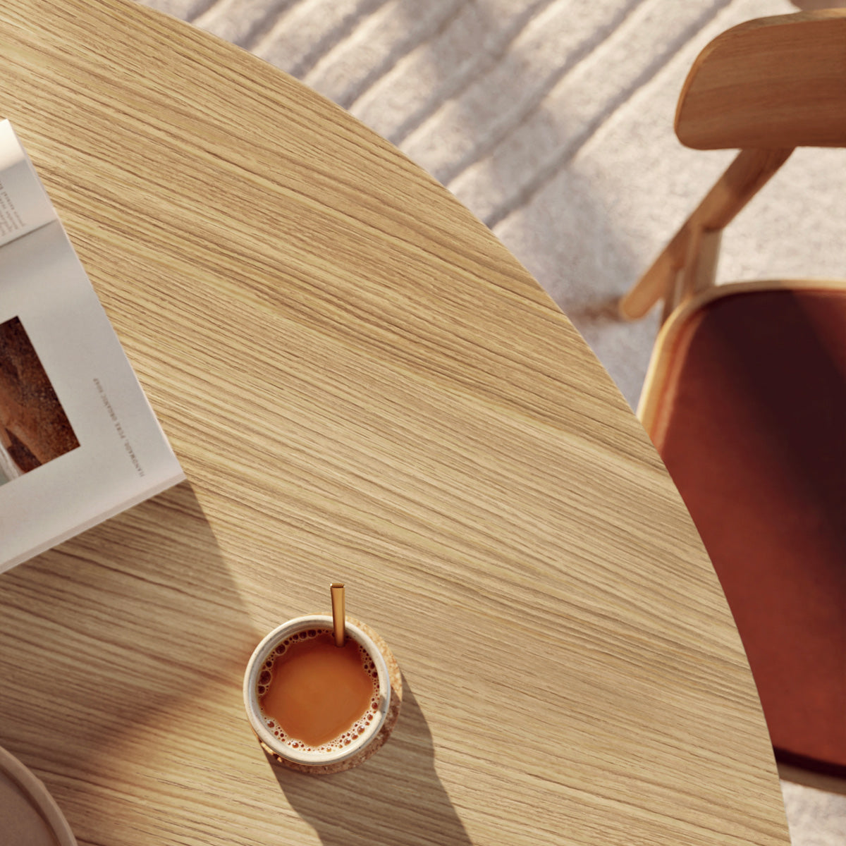 Ludo Dining Table by Woud, showing closeup view of ludo dining table with chair in live shot.