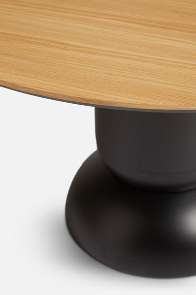 Ludo Dining Table by Woud, showing closeup view of ludo dining table in live shot.