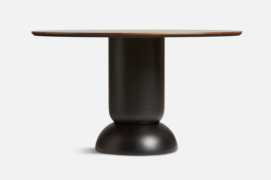 Ludo Dining Table by Woud, showing front view of ludo dining table in live shot.