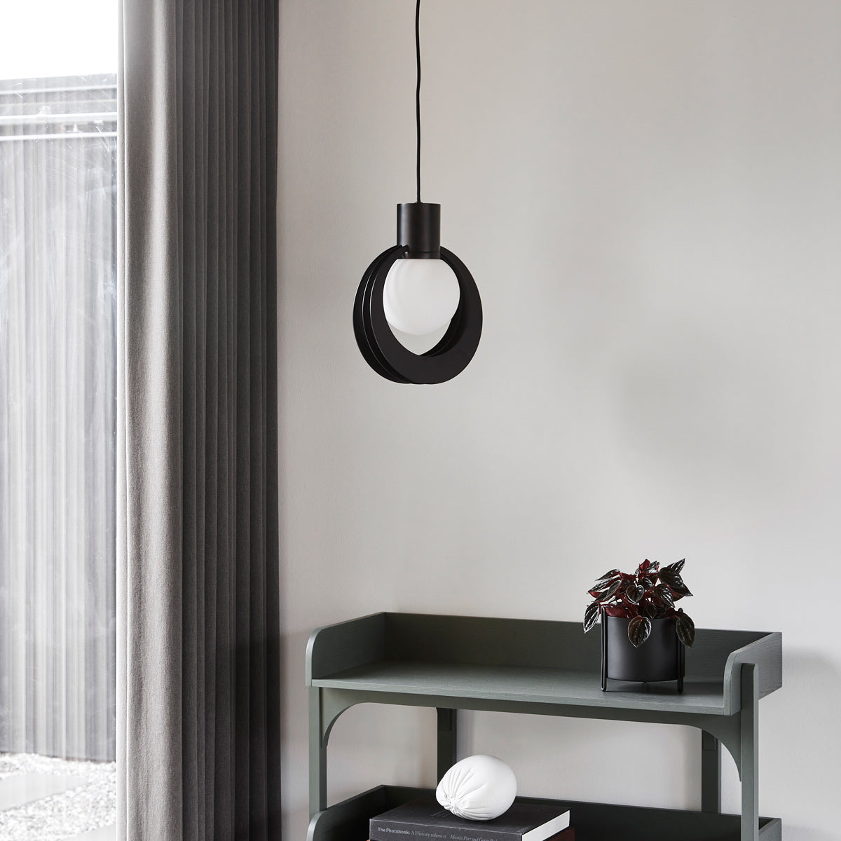 Lunar Pendant by Woud, showing lunar pendant in live shot.