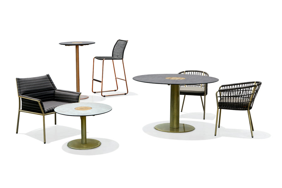Manda Aluminum Bar Side Chair by Mamagreen, showing angle view of manda aluminum bar side chair in copper neo vintage aluminum/amazon round wicker.