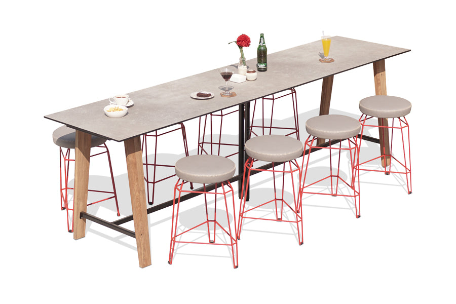 Match Round Counter Stool by Mamagreen, showing match round counter stools in fire engine gloss galvanized steel/grey taupe stamskin faux leather with table.