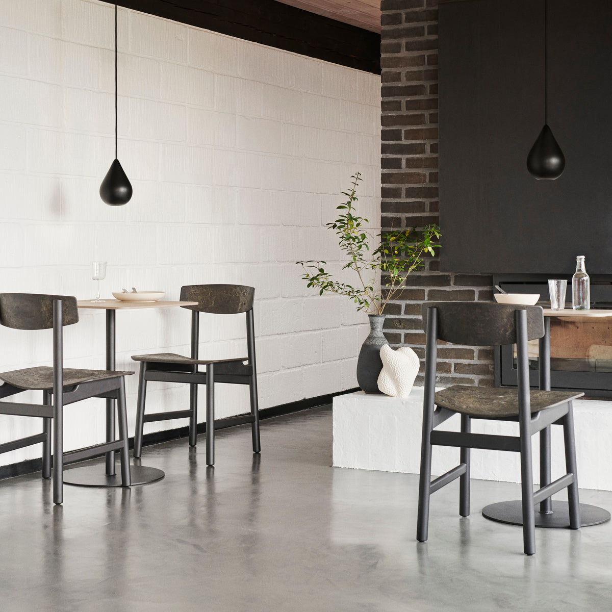 Mater Cafe Table by Mater, showing mater cafe tables in live shot.