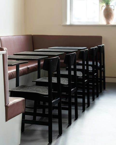 Mater Cafe Table by Mater, showing mater cafe tables in live shot.