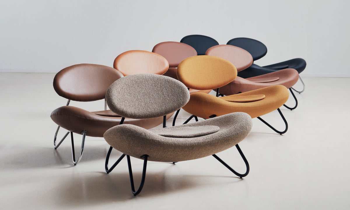 Meadow Lounge Chair by Woud, showing meadow lounge chairs in live shot.