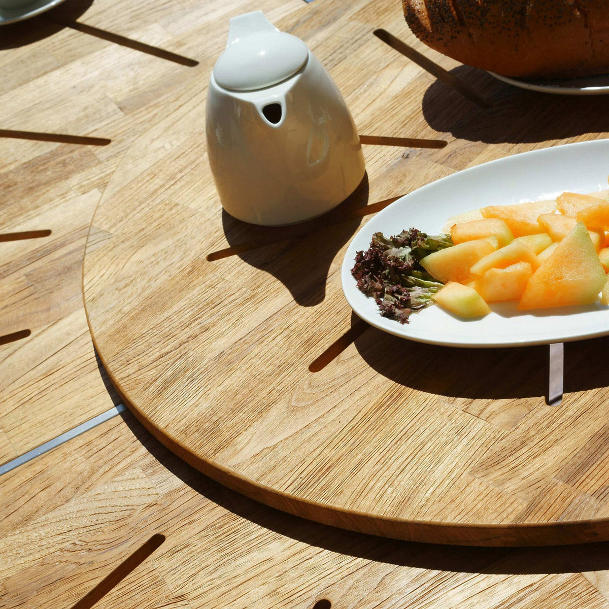 Meika Round Table with Rotating Tray by Mamagreen, showing closeup view of meika round table with rotating tray in live shot.
