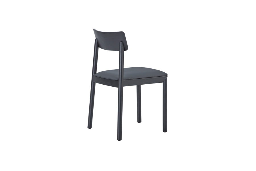 Mika Chair by B&T, showing back angle view of mika chair in black venner wood/dark gray new king eco-leather.