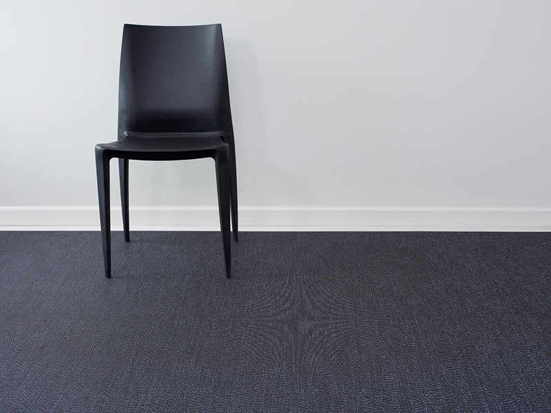 Moire Woven Floor Mat by Chilewich, showing closeup view of moire woven floor mat in live shot.