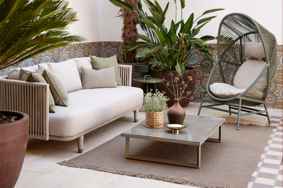 Moments Outdoor 3-Seater Sofa by Cane-Line, showing moments outdoor 3-seater sofa in live shot.