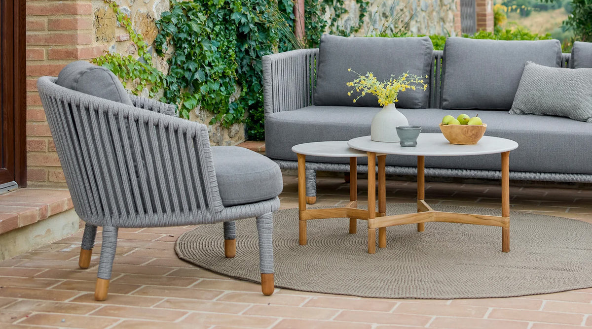 Moments Outdoor Lounge Chair by Cane-Line, showing moments outdoor lounge chair in live shot.