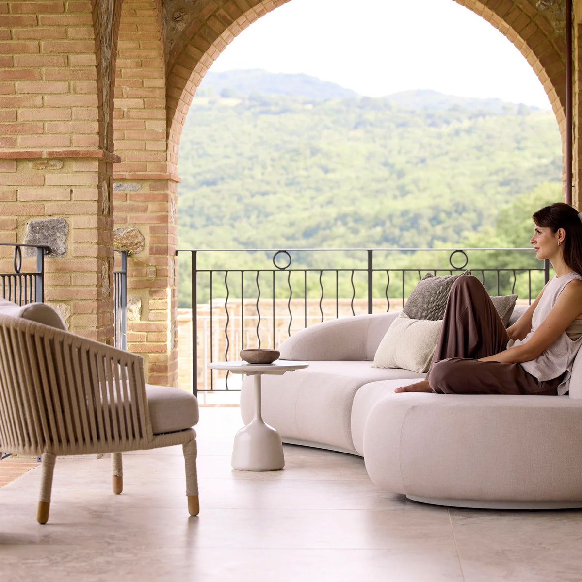 Moments Outdoor Lounge Chair by Cane-Line, showing closeup view of moments outdoor lounge chair in live shot.