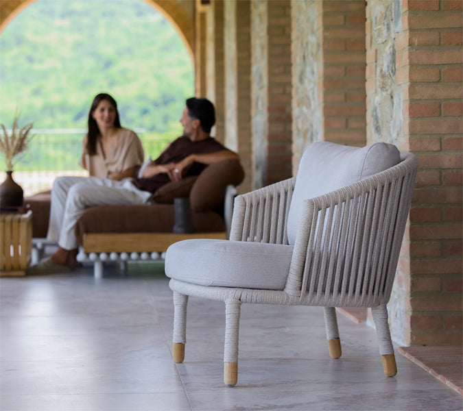 Moments Outdoor Lounge Chair by Cane-Line, showing moments outdoor lounge chair in live shot.