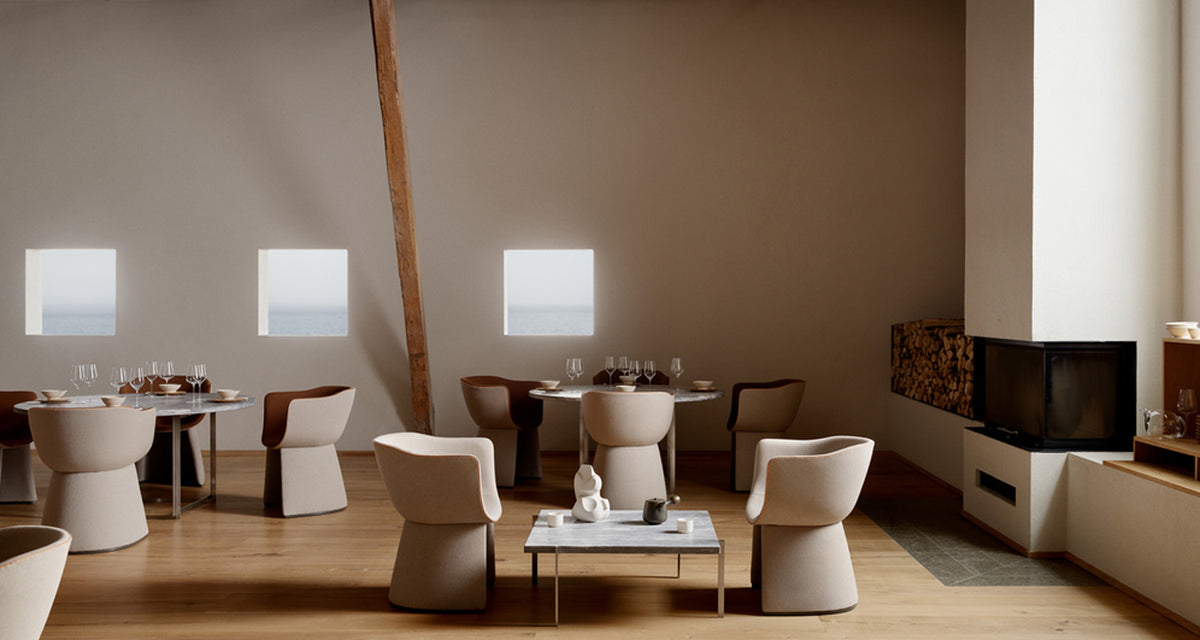 Monolit Lounge Chair by Fritz Hansen, showing monolit lounge chair in live shot.
