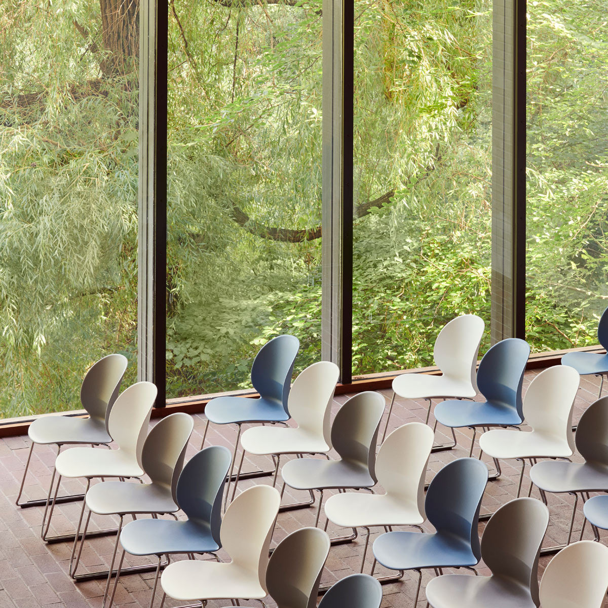 N02 Recycle Sledge Chair by Fritz Hansen , showing n02 recycle sledge chairs in live shot.
