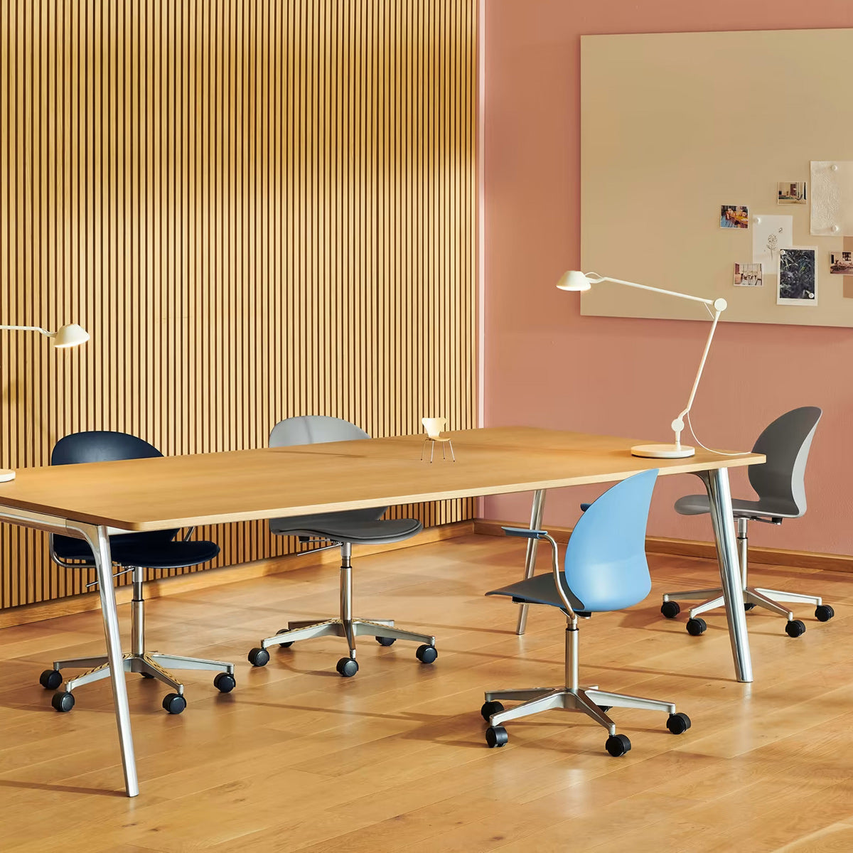 N02 Recycle Swivel Armchair by Fritz Hansen, showing n02 recycle swivel armchairs in live shot.