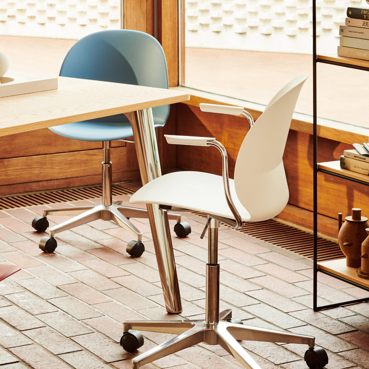 N02 Recycle Swivel Armchair by Fritz Hansen, showing n02 recycle swivel armchair in live shot.